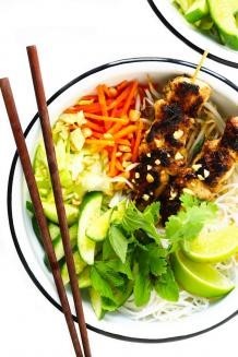 Bowl of ramen covered in vegetables and sauce