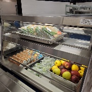 Lunch counter with milk, fruit, and salads